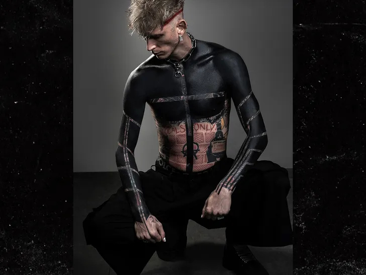 Machine Gun Kelly Unveils Dramatic Upper Torso Blackout Tattoo